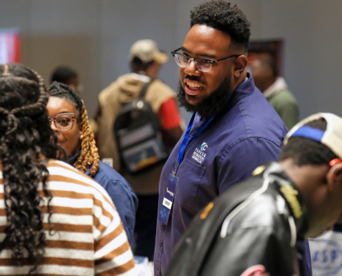 Vendor and students at Teen Summit 2026 Vendor Fair